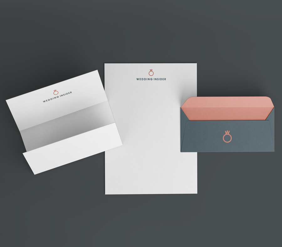 A rose gold and dark gray wedding ring symbol with a small letter "w" delicately placed on top, creating a sophisticated and elegant design that embodies the essence of Wedding Insider. The letterhead and envelope are adorned with this distinctive logo, exuding professionalism and a touch of luxury.
